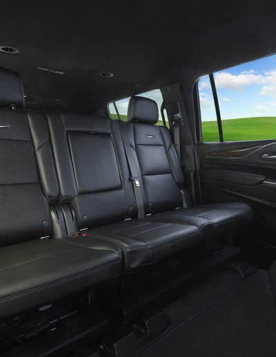 Third-row leather bench seating in a 6-door i SUV interior, designed for high-occupancy transport