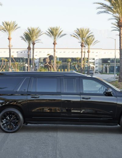 "Side profile of a CEO conversion by Quality Coachworks, featuring blacked-out styling and premium exterior trim.